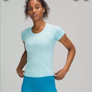 LuluLemon swiftly light blue shirt size 4